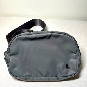 Lole Belt Bag. Minimalist Design. Charcoal Grey. Logo on belt. Adjustable